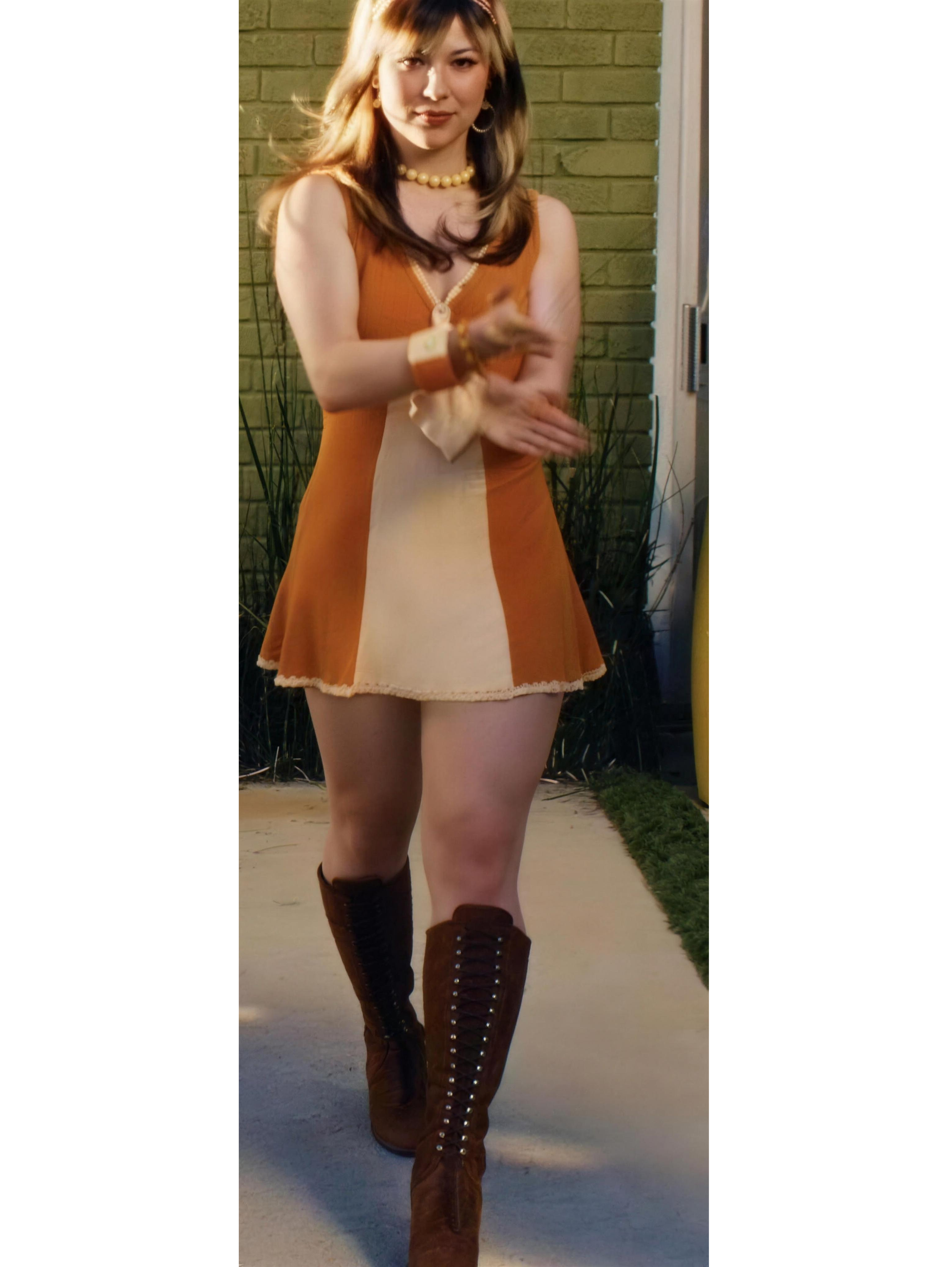 60s mod orange and cream colorblock mini dress worn with tall brown lace up boots